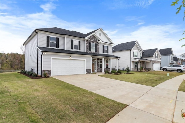 view of front of property with a garage and a front lawn