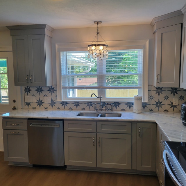 3597 Parliament Pl, Martinez, GA 30907 - kitchen with appliances with stainless steel finishes, tasteful backsplash, a chandelier, dark wood-type flooring, and gray cabinets
