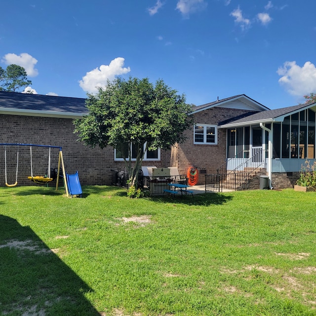 3597 Parliament Pl, Martinez, GA 30907 - back of house with a sunroom, brick siding, and crawl space