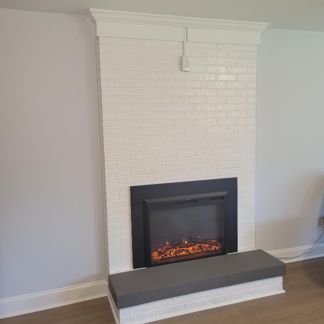 3597 Parliament Pl, Martinez, GA 30907 - detailed view of a glass covered fireplace and wood finished floors