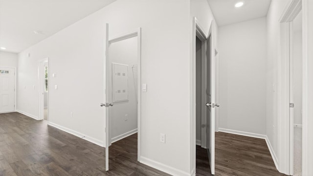 interior space featuring dark wood-style flooring, baseboards, and recessed lighting
