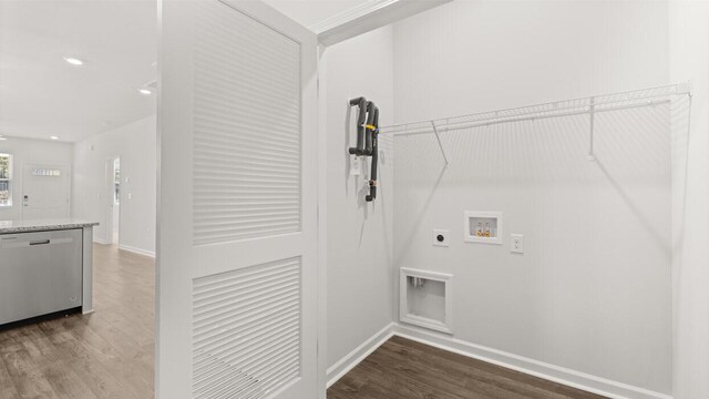 laundry area featuring hookup for an electric dryer, washer hookup, baseboards, laundry area, and wood finished floors