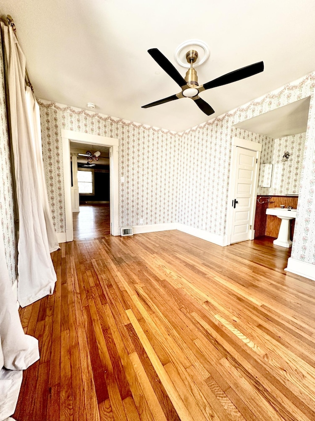 interior space featuring light hardwood / wood-style floors and ceiling fan