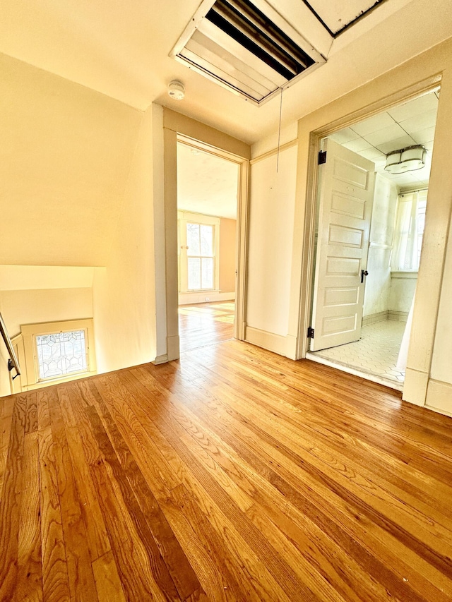 unfurnished room with light hardwood / wood-style floors