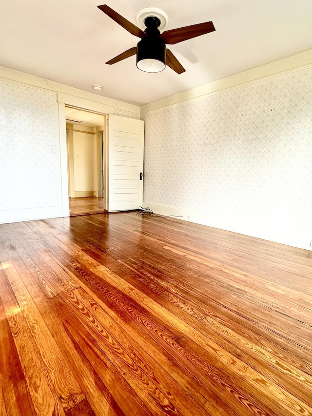 unfurnished bedroom with hardwood / wood-style floors and ceiling fan