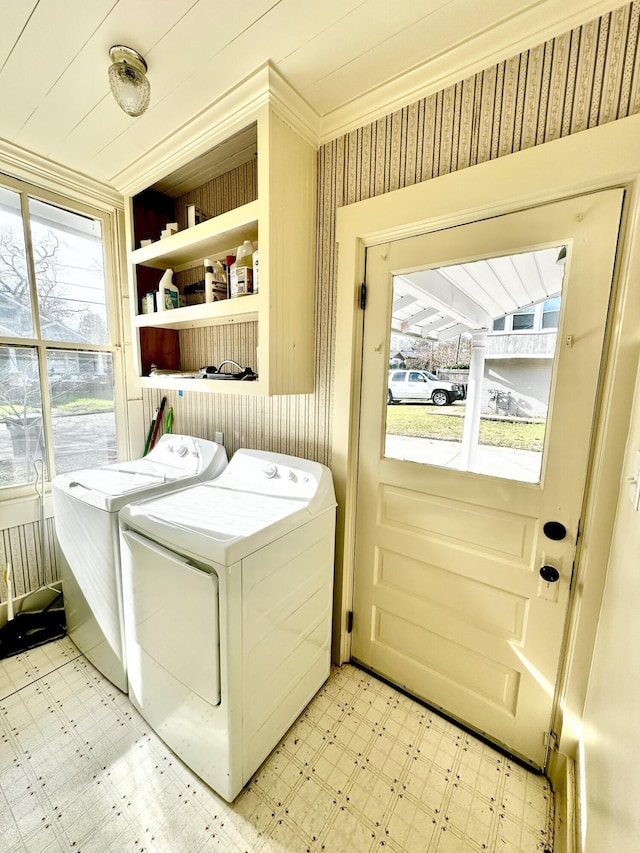 laundry area featuring washer and dryer and a healthy amount of sunlight