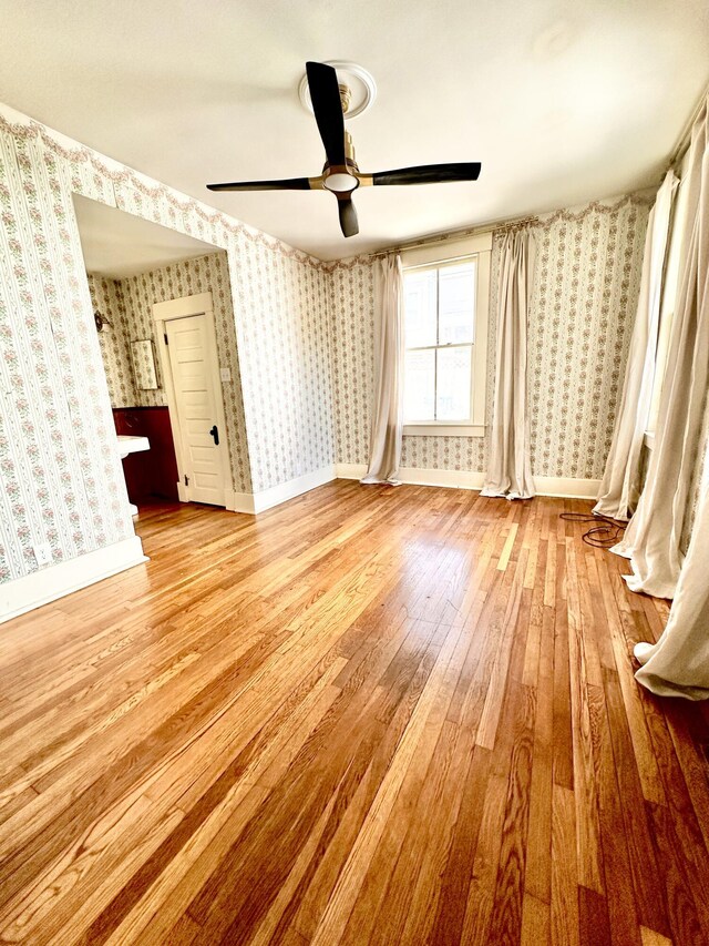 interior space featuring light hardwood / wood-style floors and ceiling fan