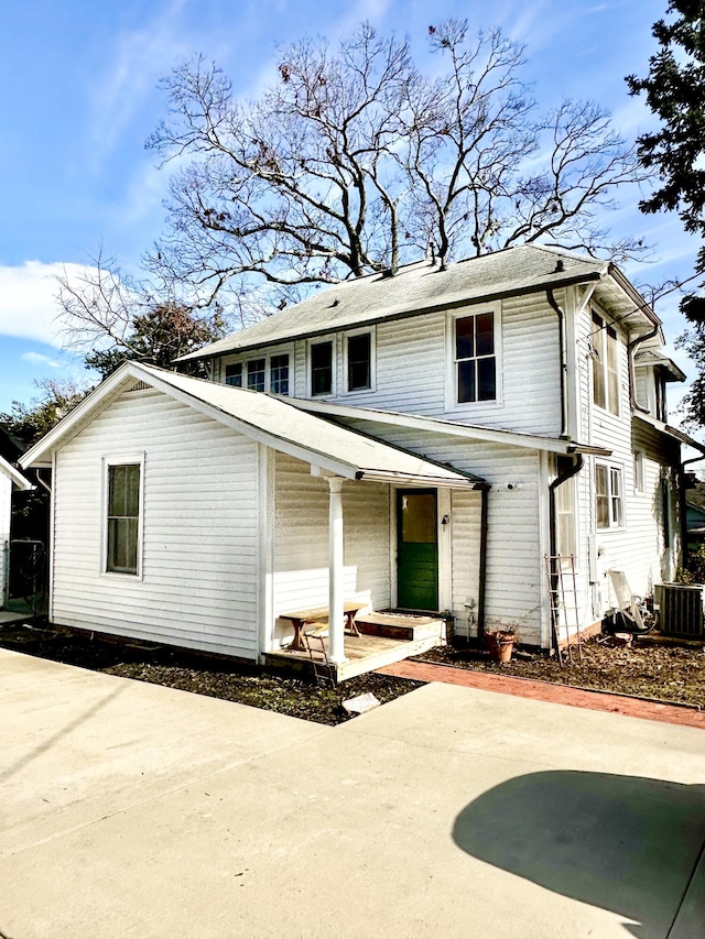 view of front property with central AC unit