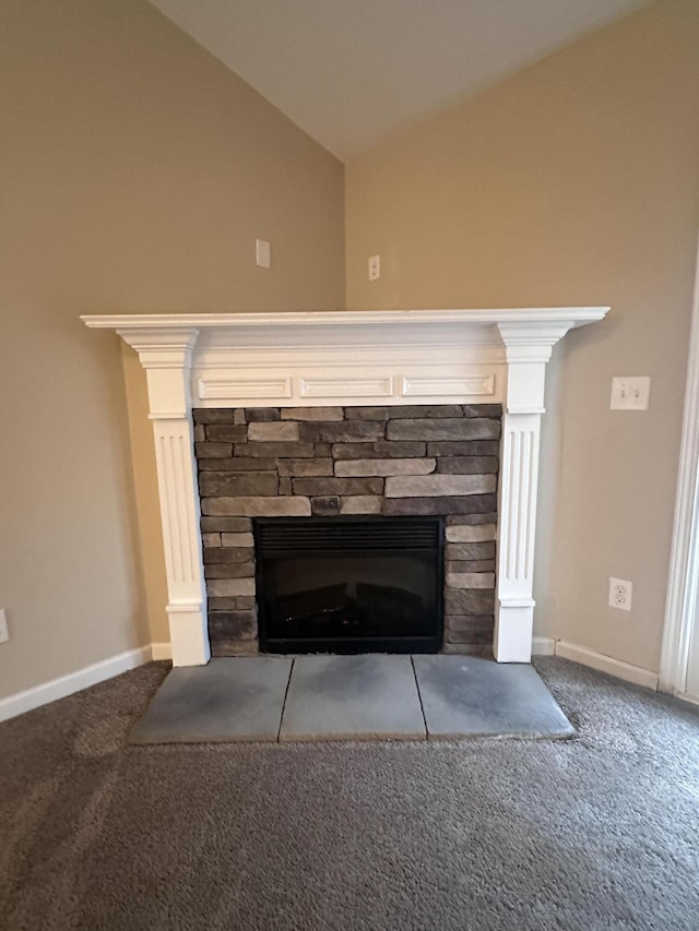 room details featuring carpet flooring and a fireplace