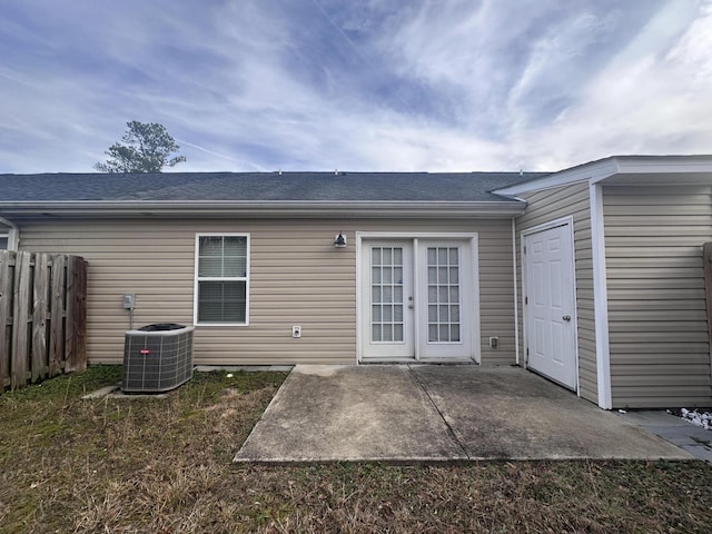 back of house with cooling unit, a patio area, and french doors