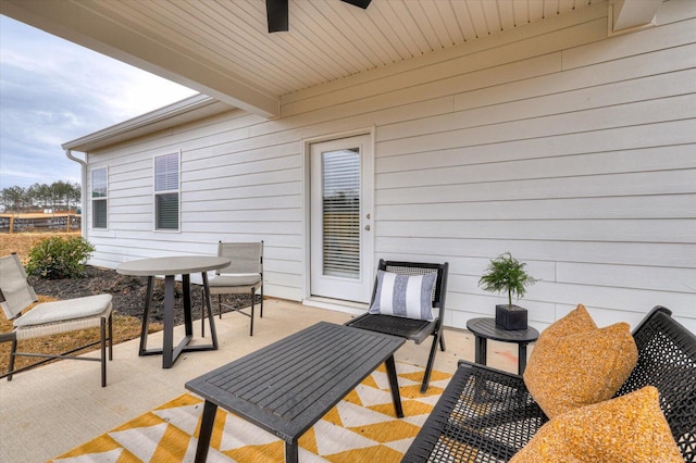 view of patio featuring ceiling fan