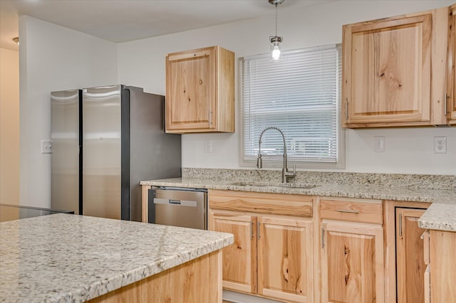 2426 Dickey Rd, Augusta, GA 30906 - kitchen with light brown cabinetry, appliances with stainless steel finishes, light stone counters, and decorative light fixtures