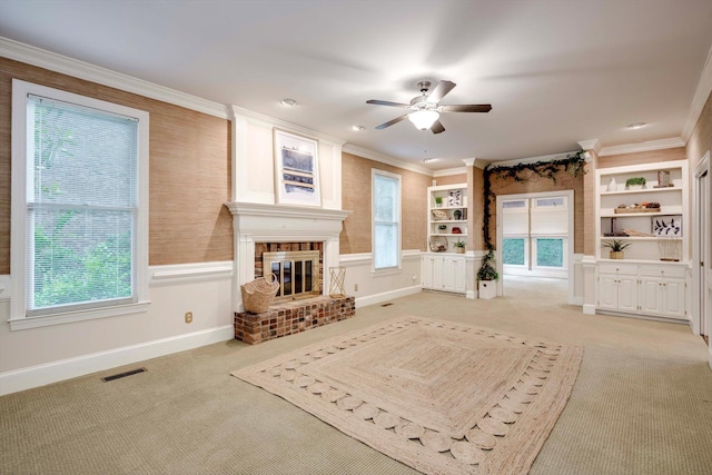 615 Stevens Xing, Augusta, GA 30907 - living room with ceiling fan, a fireplace, light colored carpet, crown molding, and built in features