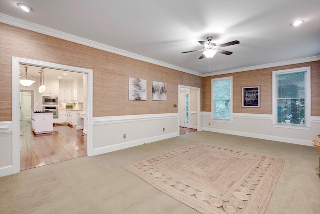 615 Stevens Xing, Augusta, GA 30907 - unfurnished room with a ceiling fan, light colored carpet, ornamental molding, a wainscoted wall, and recessed lighting