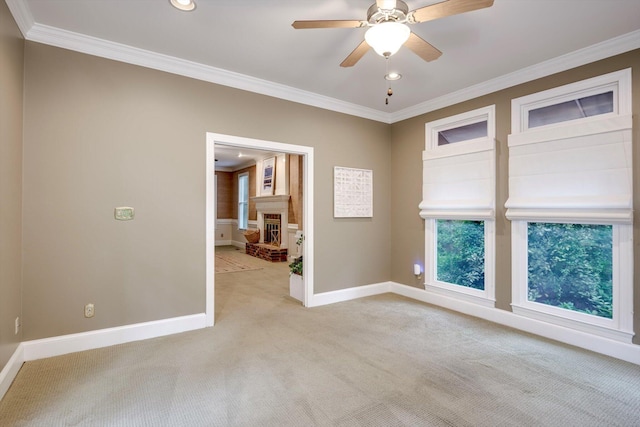 615 Stevens Xing, Augusta, GA 30907 - spare room featuring light carpet, ornamental molding, a fireplace, a ceiling fan, and recessed lighting
