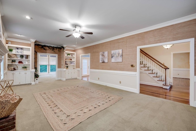 615 Stevens Xing, Augusta, GA 30907 - living room with light carpet, a ceiling fan, stairs, ornamental molding, and built in features