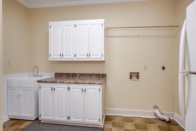 615 Stevens Xing, Augusta, GA 30907 - laundry area with electric dryer hookup, hookup for a washing machine, cabinet space, light tile patterned floors, and ornamental molding