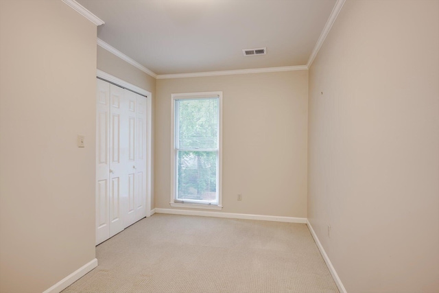 615 Stevens Xing, Augusta, GA 30907 - unfurnished bedroom with crown molding, light colored carpet, and a closet