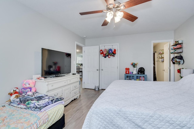 bedroom with light wood-style floors and ceiling fan