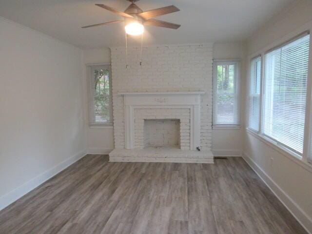 2072 Battle Row, Augusta, GA 30904 - unfurnished living room featuring wood finished floors, a ceiling fan, and a fireplace