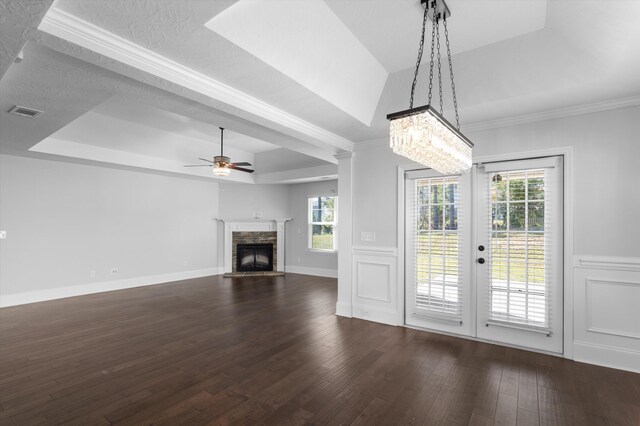 5174 Copse Dr, Augusta, GA 30909 - unfurnished living room with a raised ceiling, dark wood-type flooring, a fireplace, plenty of natural light, and wainscoting