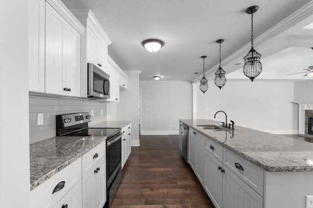 5174 Copse Dr, Augusta, GA 30909 - kitchen featuring appliances with stainless steel finishes, backsplash, white cabinetry, dark wood-style flooring, and light stone countertops