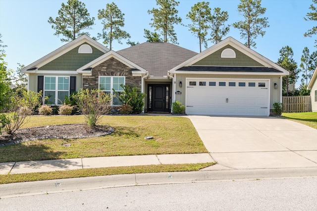 5174 Copse Dr, Augusta, GA 30909 - view of front facade featuring stone siding, a garage, and concrete driveway