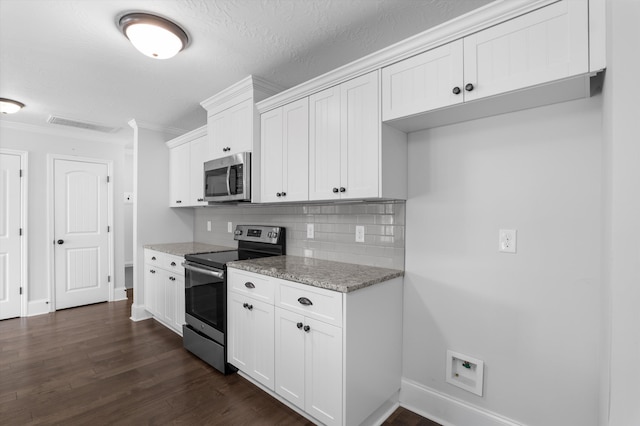 5174 Copse Dr, Augusta, GA 30909 - kitchen featuring appliances with stainless steel finishes, ornamental molding, tasteful backsplash, dark wood-type flooring, and white cabinets
