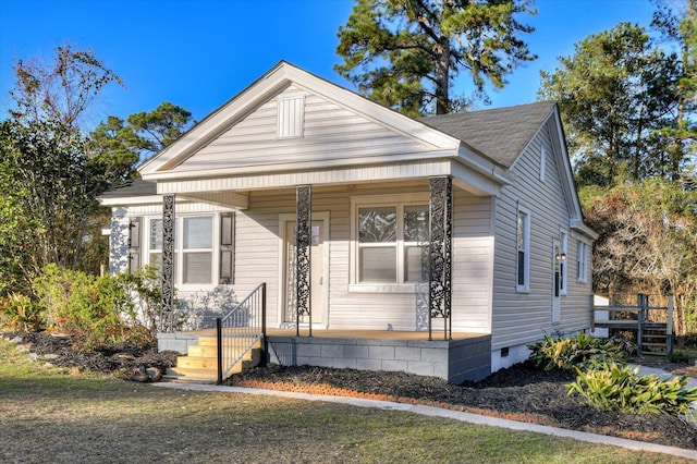view of front of property with crawl space and covered porch