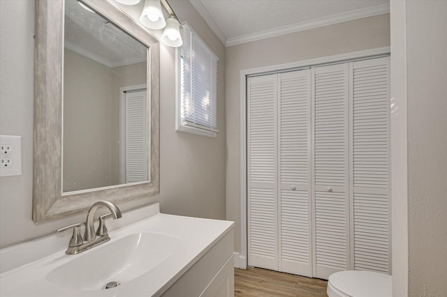 bathroom with ornamental molding and a closet