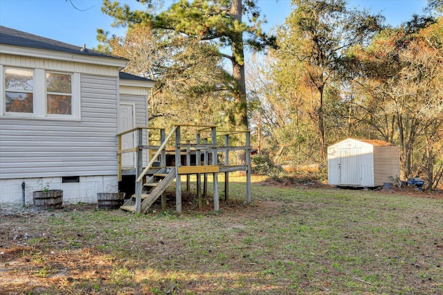 view of yard with a deck, an outdoor structure, and a storage unit