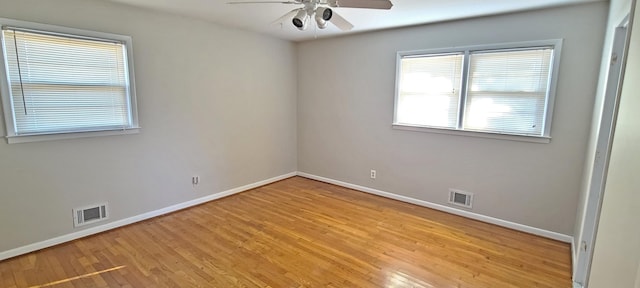 unfurnished room with ceiling fan and light wood-type flooring