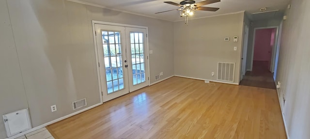 spare room with french doors, ceiling fan, ornamental molding, and light hardwood / wood-style floors