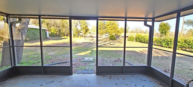 unfurnished sunroom with plenty of natural light