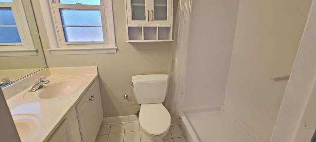 bathroom with vanity, tile patterned floors, and toilet