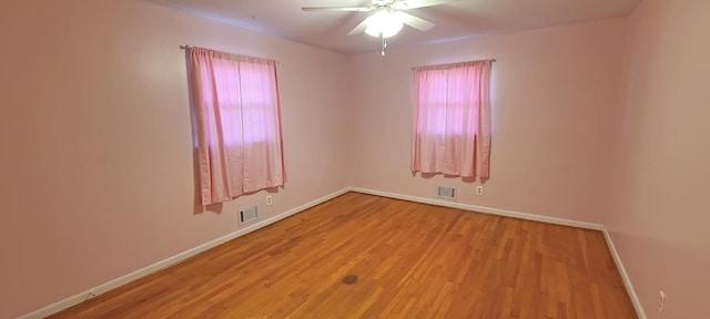 unfurnished room featuring ceiling fan, plenty of natural light, and light hardwood / wood-style floors