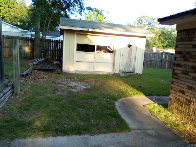 view of outbuilding with a lawn