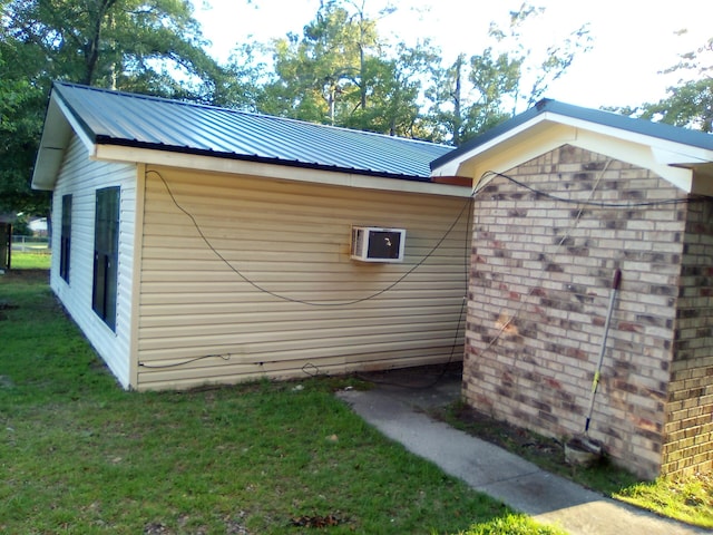 view of side of property with a yard