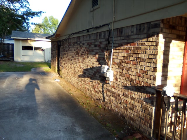 view of property exterior with an outbuilding