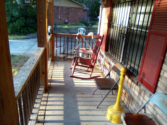 balcony featuring a porch