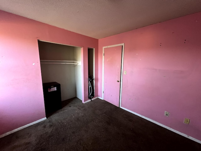 unfurnished bedroom featuring carpet floors and a closet