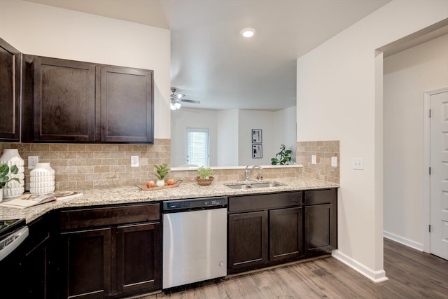 2178 River Park Ct, Augusta, GA 30907 - kitchen featuring appliances with stainless steel finishes, dark brown cabinets, light wood finished floors, and tasteful backsplash