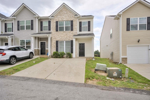 2178 River Park Ct, Augusta, GA 30907 - townhome / multi-family property featuring an attached garage, brick siding, and concrete driveway