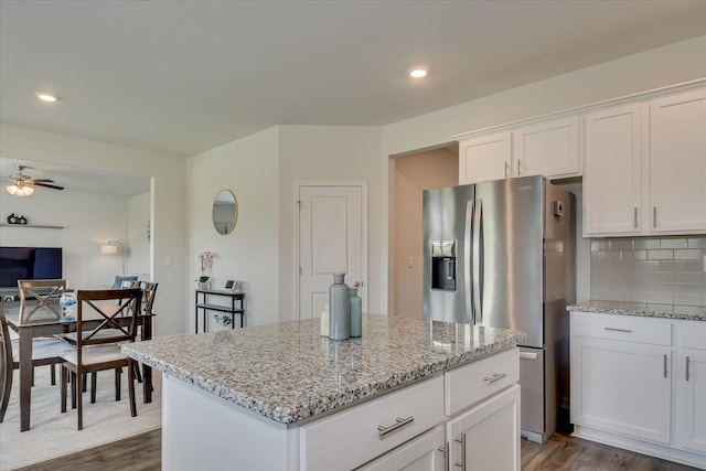 427 Roebuck Pass, Grovetown, GA 30813 - kitchen featuring stainless steel refrigerator with ice dispenser, dark wood-style flooring, a center island, light stone countertops, and recessed lighting