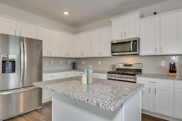 427 Roebuck Pass, Grovetown, GA 30813 - kitchen featuring stainless steel appliances, white cabinetry, wood finished floors, decorative backsplash, and recessed lighting