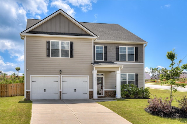 427 Roebuck Pass, Grovetown, GA 30813 - view of front of property with an attached garage, concrete driveway, a shingled roof, stone siding, and board and batten siding