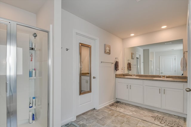 427 Roebuck Pass, Grovetown, GA 30813 - bathroom with a shower stall, double vanity, baseboards, and recessed lighting