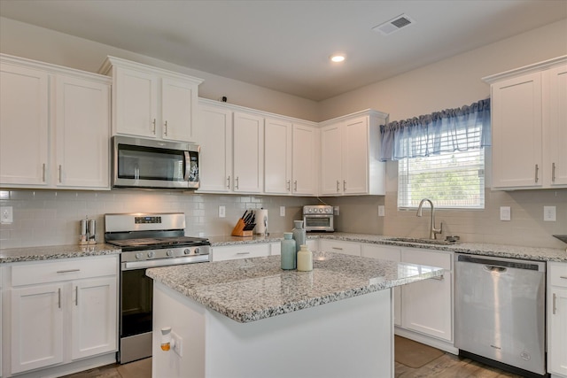 427 Roebuck Pass, Grovetown, GA 30813 - kitchen featuring appliances with stainless steel finishes, a sink, white cabinetry, tasteful backsplash, and recessed lighting