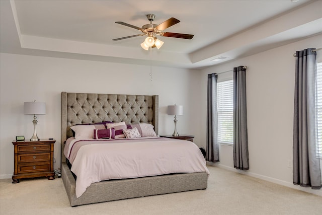 427 Roebuck Pass, Grovetown, GA 30813 - bedroom featuring a tray ceiling, light carpet, baseboards, and ceiling fan