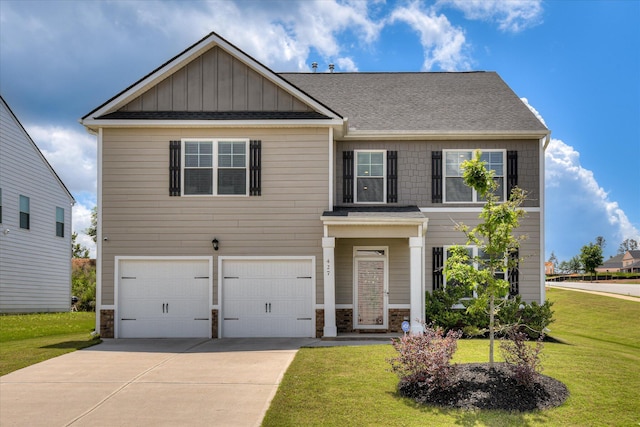 427 Roebuck Pass, Grovetown, GA 30813 - craftsman-style house with an attached garage, driveway, a front lawn, a shingled roof, and stone siding